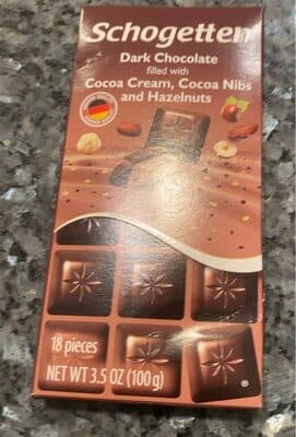 Dark Chocolate filled with Cocoa Cream, Cocoa Nibs and Hazelnuts by Schogetten - 70% chocolate bar